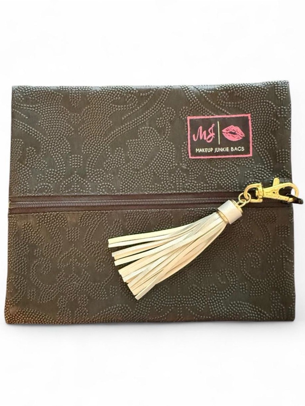MAKEUP JUNKIE small bag with raised design and silver tassel. Clean inside/out